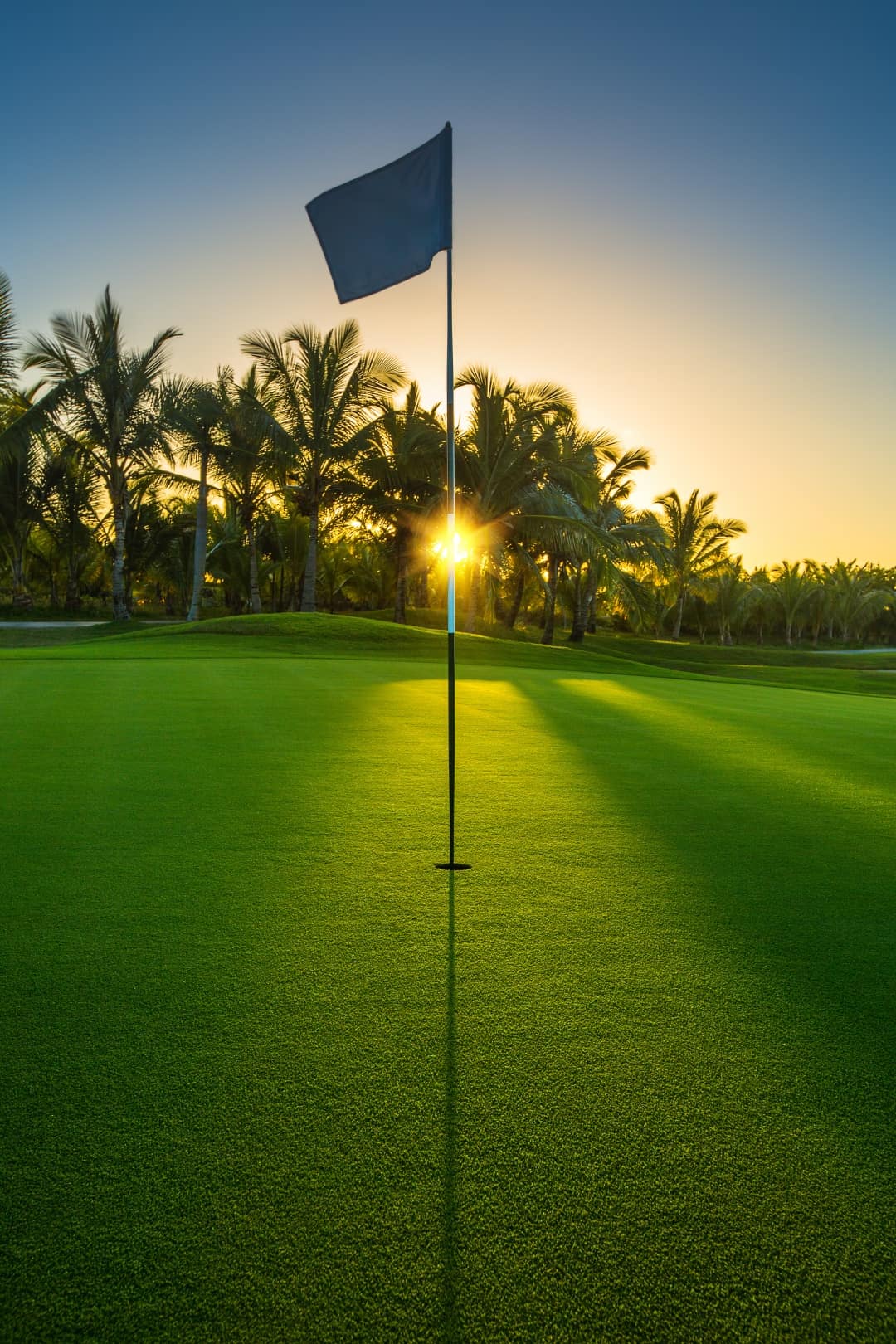 golf course hole sunset